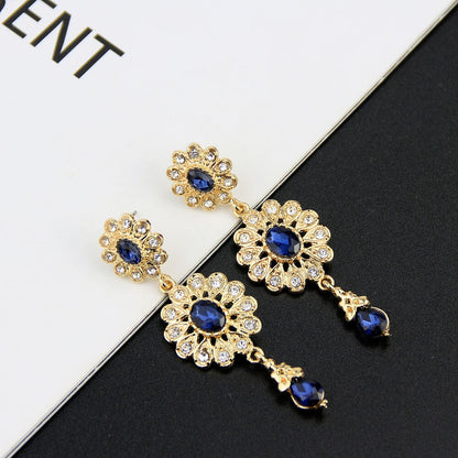 boucle d'oreille en forme de goutte d'eau pour femmes couleur or.