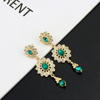 boucle d'oreille en forme de goutte d'eau pour femmes couleur or.