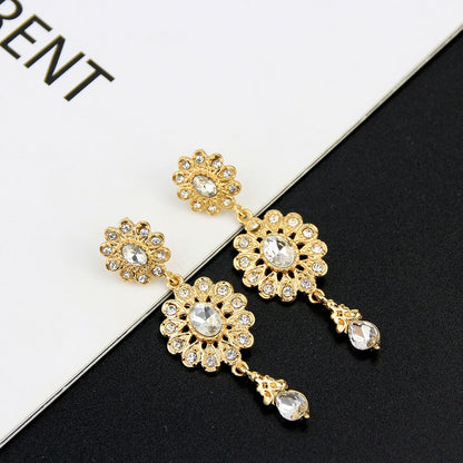 boucle d'oreille en forme de goutte d'eau pour femmes couleur or.
