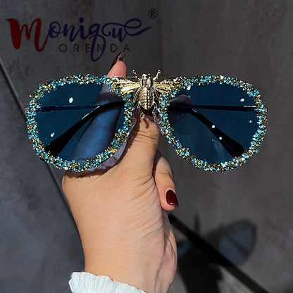 Lunettes de soleil de luxe pour femmes, monture métallique.
